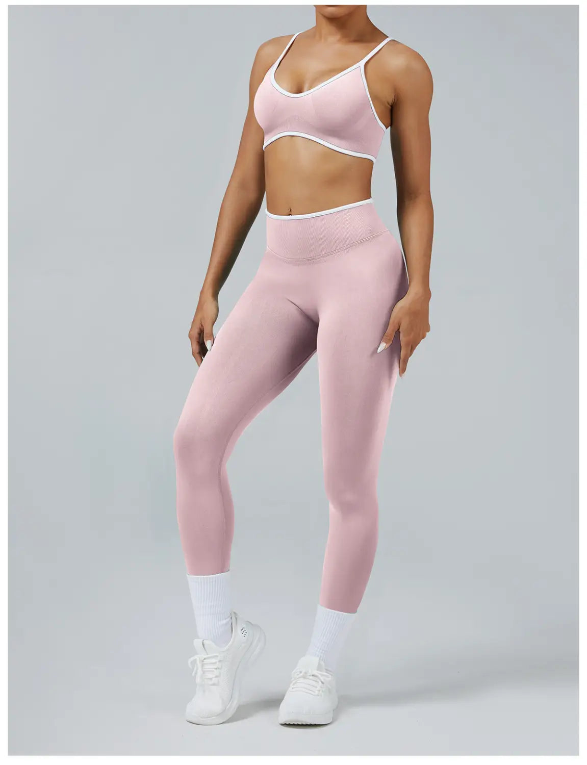 Seamless high waist sports yoga leggings in pink with white trim along the waistband and straps.
