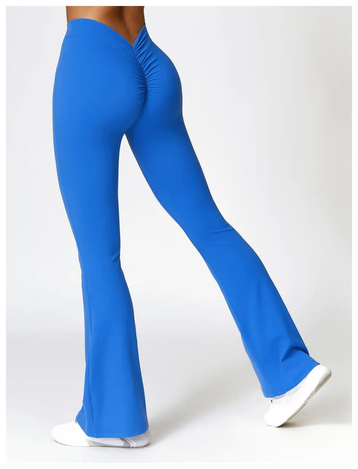 bright blue high-waisted flared yoga pants active trousers shown from the back with a ruched design enhancing the fit and style