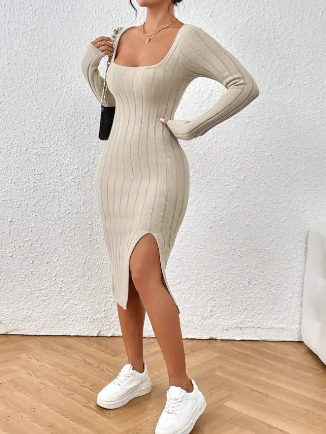 A beige ribbed knit midi dress with a square neckline long sleeves and a high side slit.