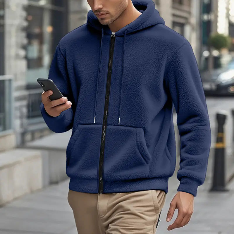 Men’s fleece lined loose zip up hooded jacket in navy blue with a black zipper and white drawstrings featuring a soft fleece lining for warmth.