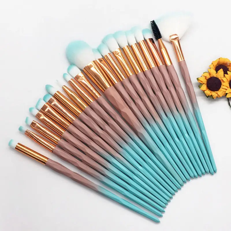 Makeup brush set 20 piece rose gold and glitter featuring gradient pink to teal handles, rose gold ferrules, and white bristles.