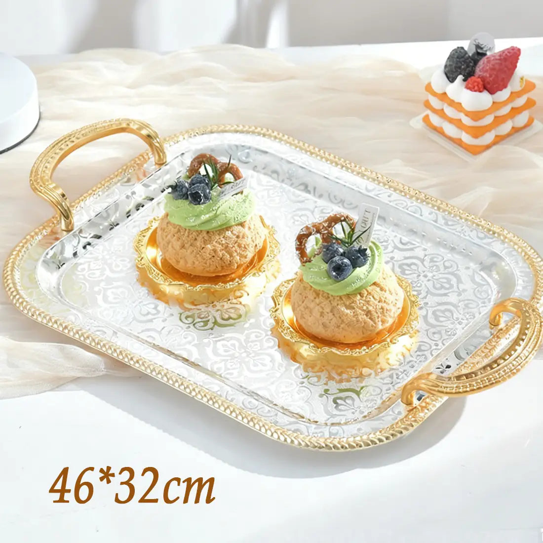 Luxury rectangle serving tray with ornate gold handles and a silver-toned embossed floral pattern on the surface.