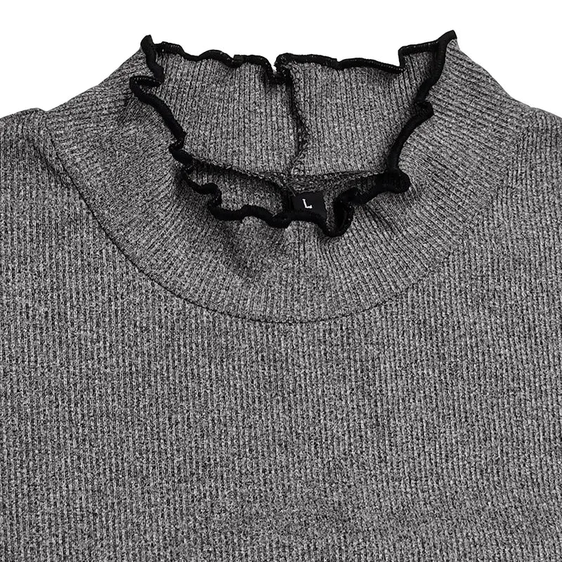 Gray ribbed knit slim fit women’s sweater featuring a black ruffled mock neck collar.