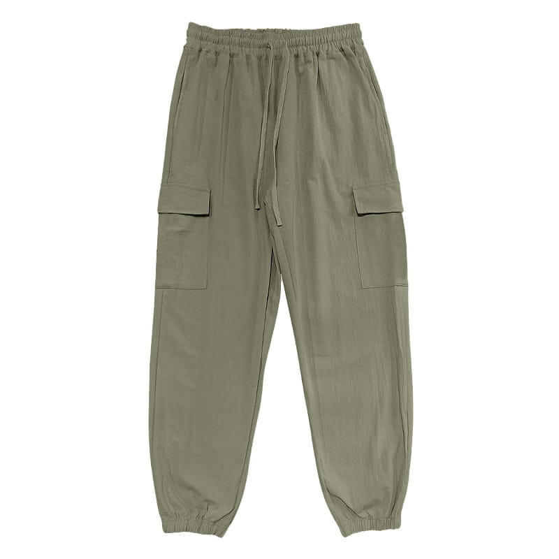 Men linen cargo pants in olive green with elastic waistband, drawstring, two large side pockets, and tapered cuffs at the ankle.