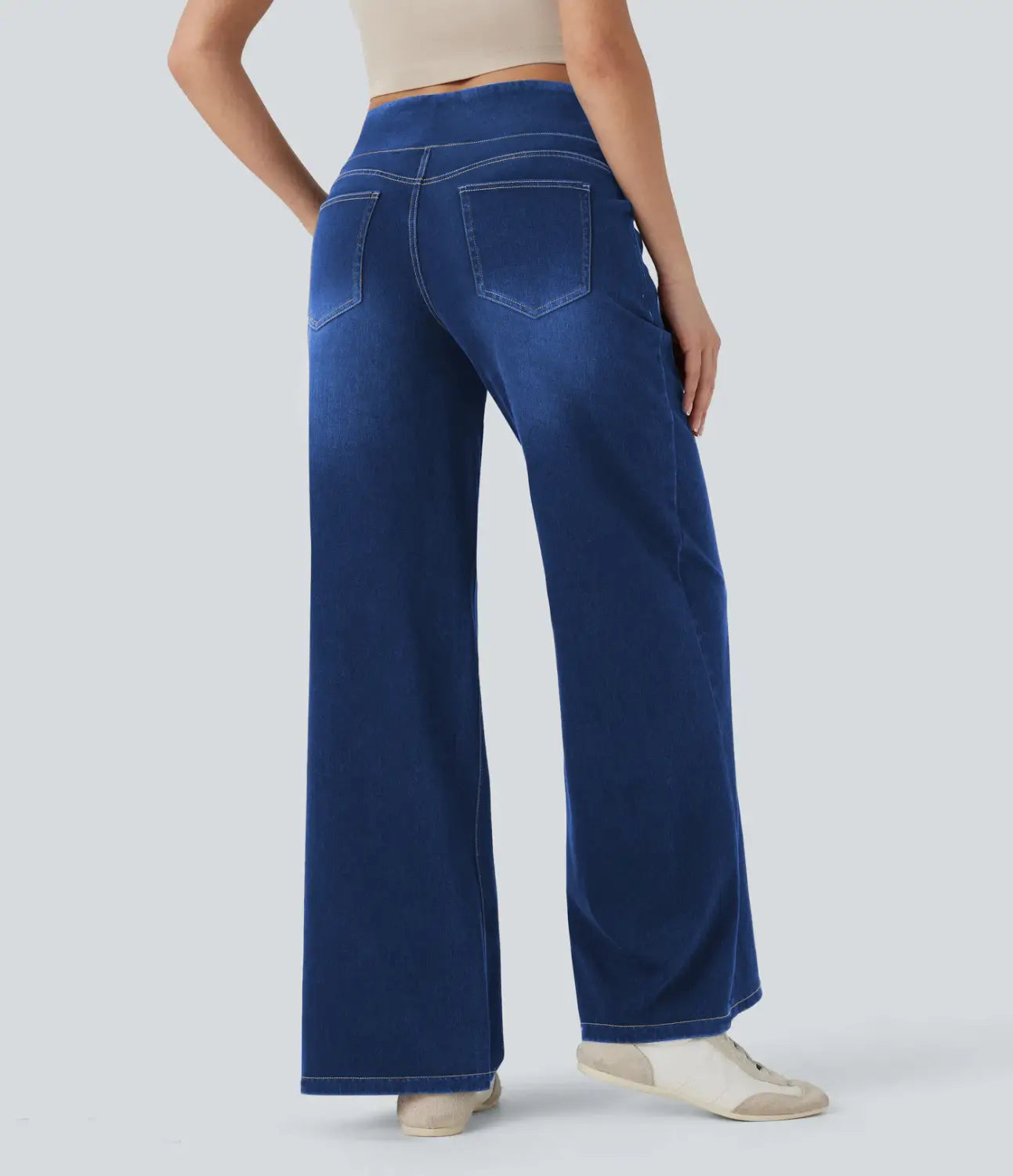 blue wide-leg stretchy high waisted denim jeans shown from the back with high waist and back pockets