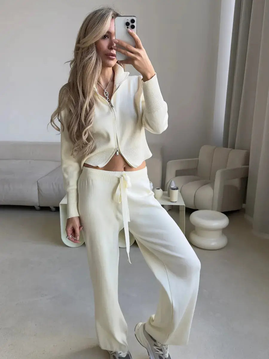 cream-colored knit cropped hoodie with front zipper and ribbed cuffs from the women’s knit zip up cardigan and wide leg pant set