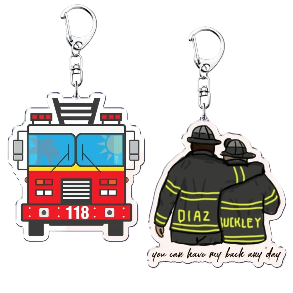 Two clear acrylic 9-1-1 tv show keychains featuring a red fire truck and firefighters in black uniforms as a firefighter gift