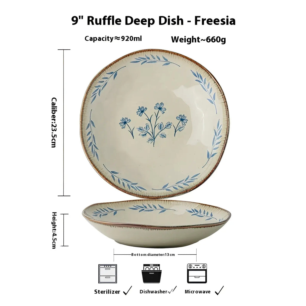 Cream-colored ceramic 9-inch deep dish plate with ruffle edge and delicate blue floral leaf patterns
