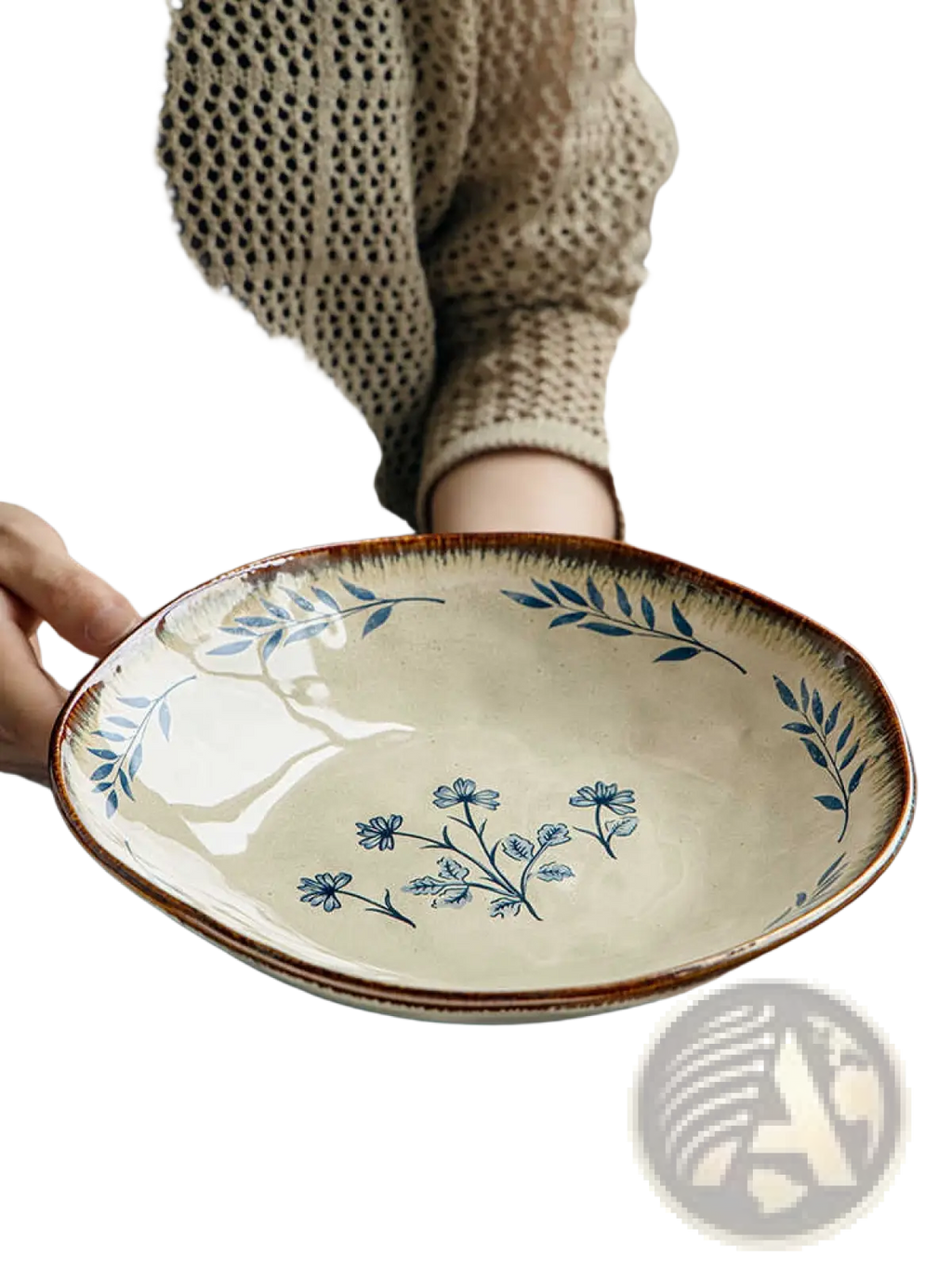 A cream-colored 9-inch ceramic deep plate with a rustic brown rim and delicate blue leaf floral pattern