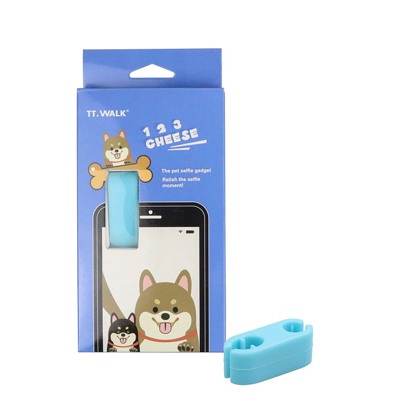 Light blue silicone pet selfie phone clip with a dog-shaped clip and bone design for use as a pet selfie stick and dog toy set.
