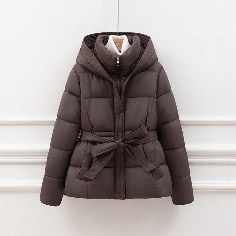 Women quilted hooded winter puffer coat in dark brown with a matching belt tied at the waist and a plush white lining inside the collar.
