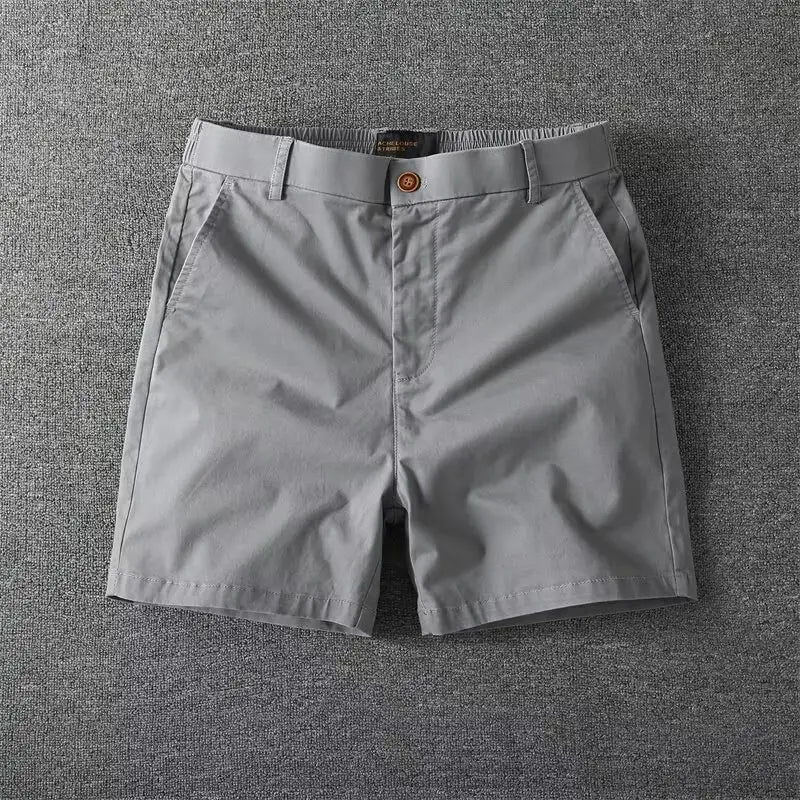 Men casual slim fit cargo shorts in gray chino fabric with button closure and belt loops.