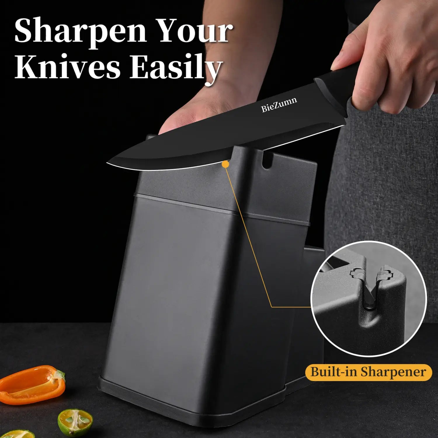 black biezumn stainless steel knife resting on a black built-in sharpener from a 15 piece chef block set