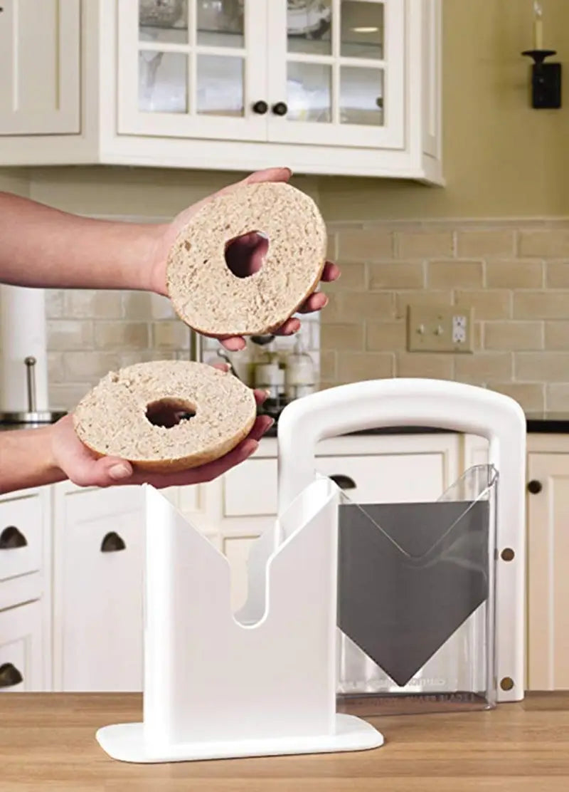 white plastic bagel slicer guillotine with clear acrylic blade guard and safety guard for secure slicing