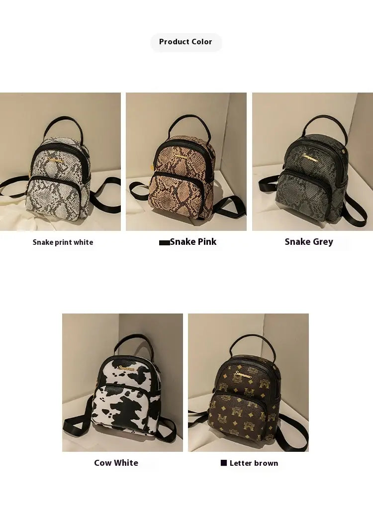 White snake print mini backpack with black straps and trim in Korean style featuring cow and snake print design.