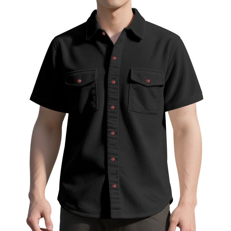 Loose corduroy short sleeve workwear shirt in black with red buttons and two chest pockets made of corduroy fabric.