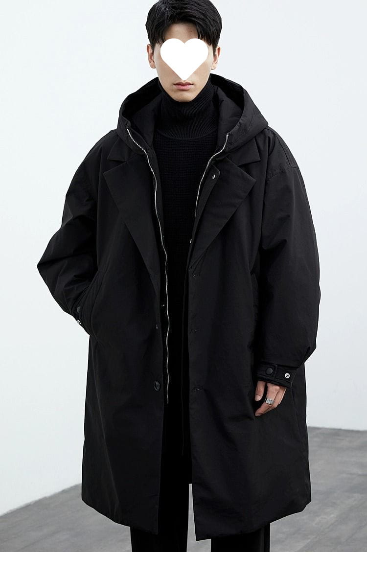 Black hooded trench coat with sleek modern design and subtle silver zipper accents for men winter wear.