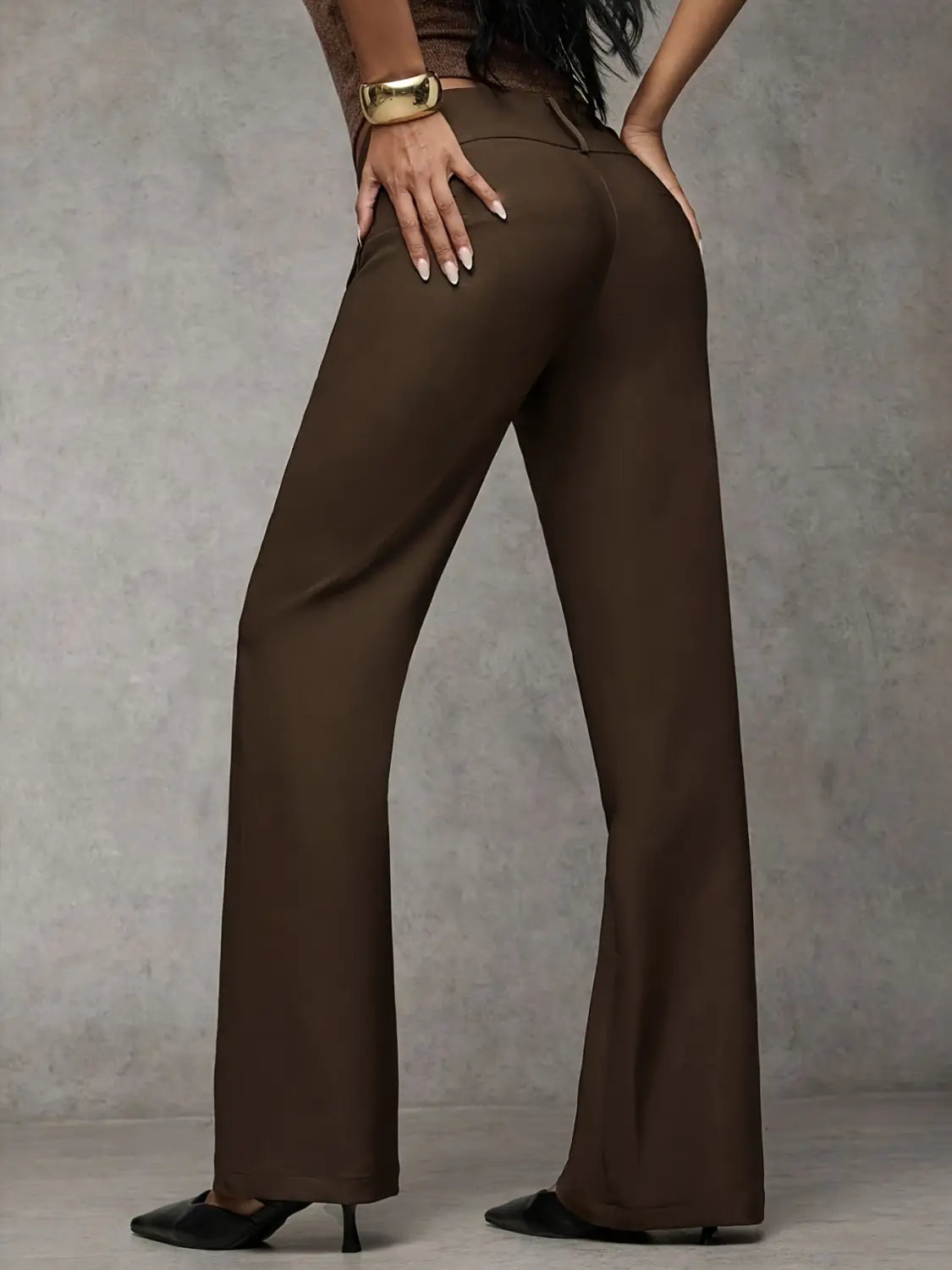 Brown wide-leg work pants with a high waist and sleek tailored fit featuring subtle creasing along the fabric for casual wear.