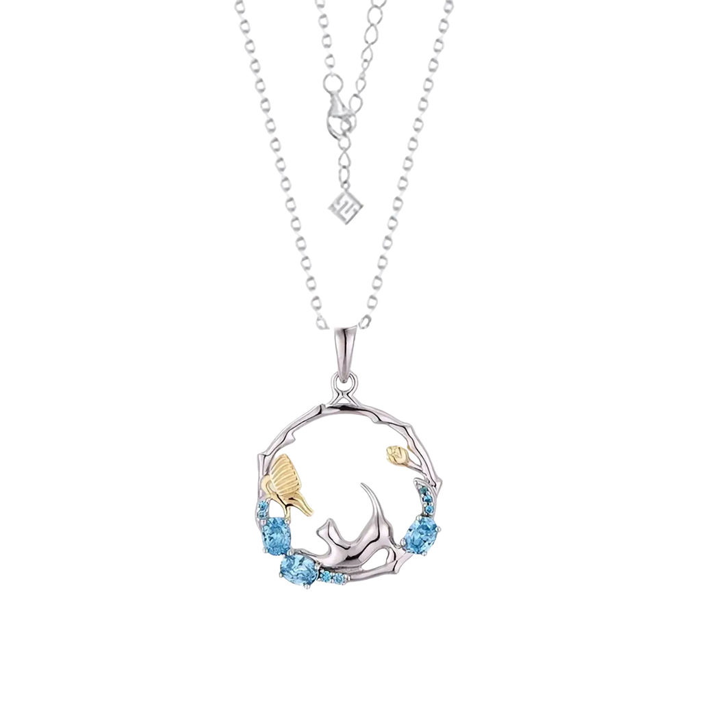 925 silver cat zirconia necklace pendant with silver and gold tones and blue gemstones in circular design edge