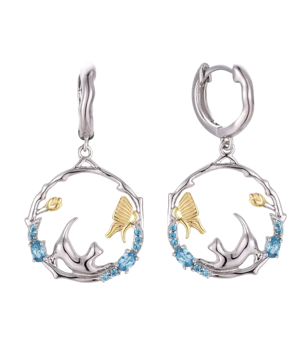 Two-tone silver and gold hoop earrings with butterfly and floral designs accented by blue gemstones from 925 silver cat zirconia jewelry set