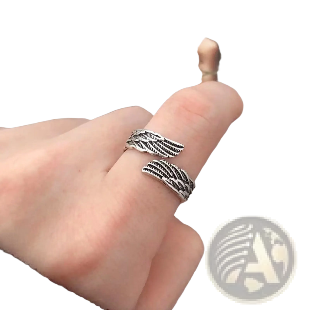 925 sterling silver angel wing ring in silver with intricate feather detailing showcasing elegant craftsmanship