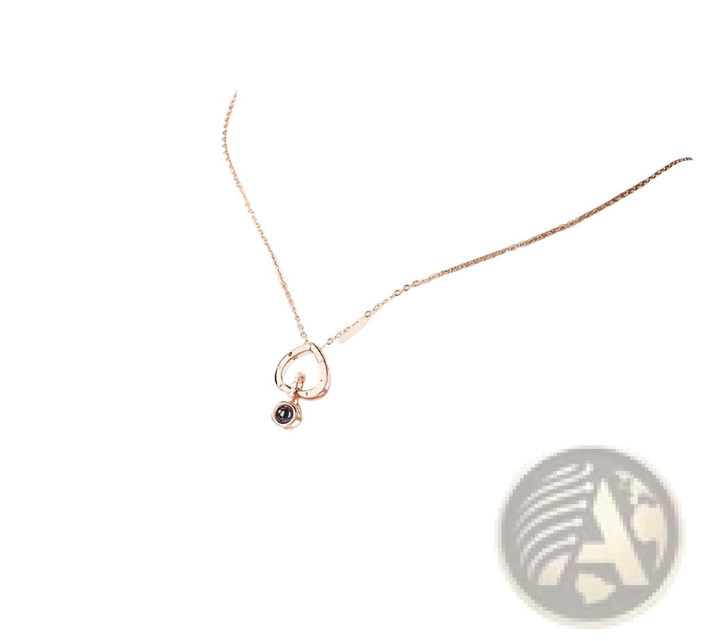 A delicate 925 sterling silver rose gold necklace with an open circular pendant and small black gemstone accent