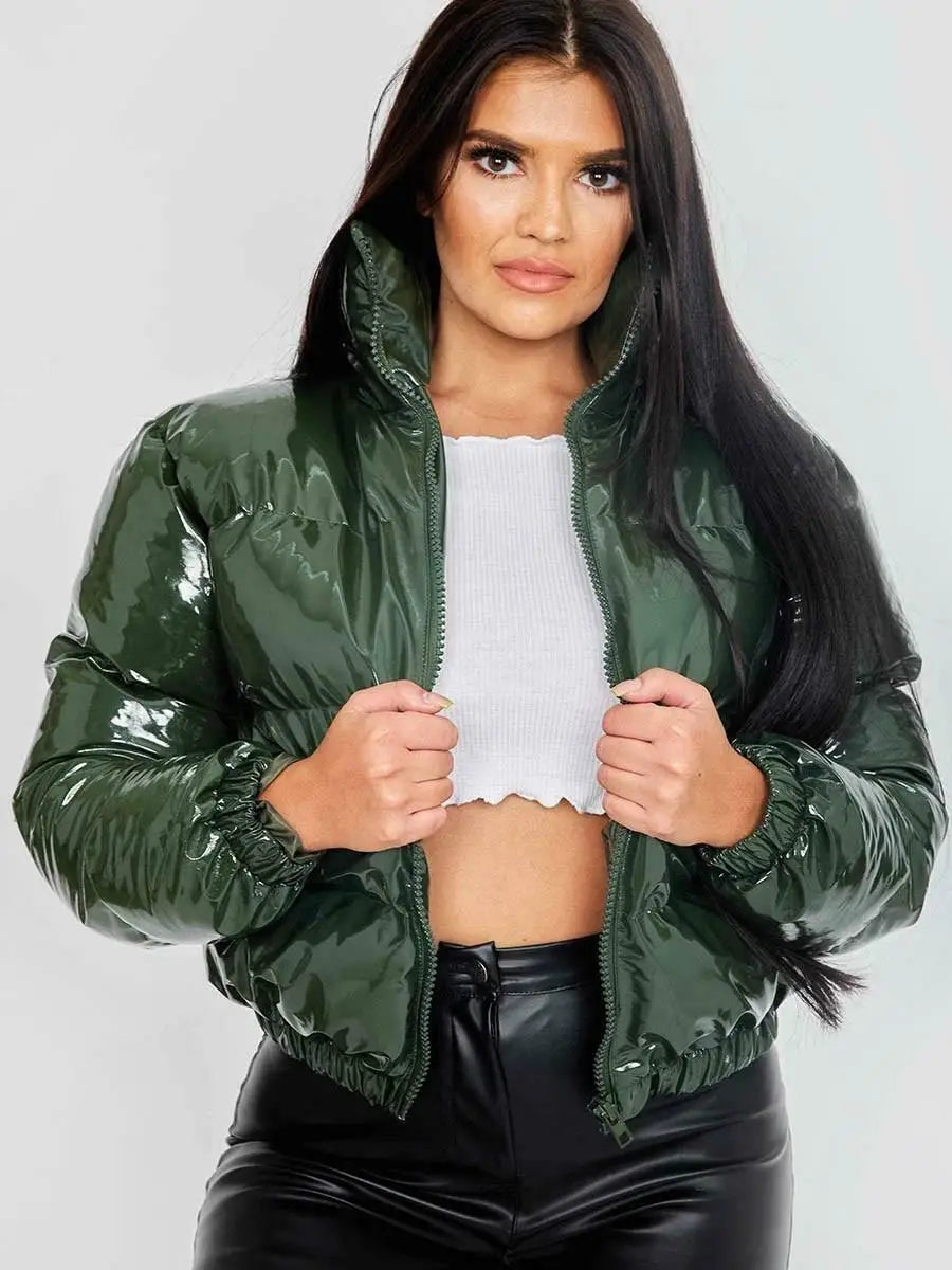 A shiny olive green glossy puffer jacket short with high collar elastic cuffs and cotton padding designed for women warm wear.