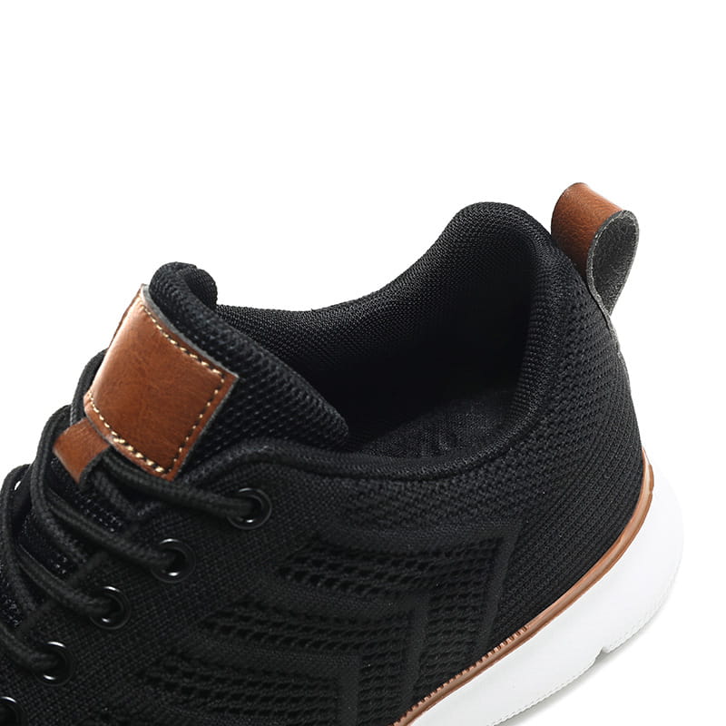 black mesh sneaker for men with brown leather accents and a white sole designed as casual flying woven shoes.