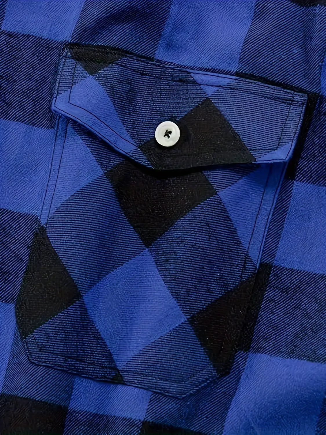 Men’s slim fit plaid flannel button up shirt in blue and black with a white button on the chest pocket.