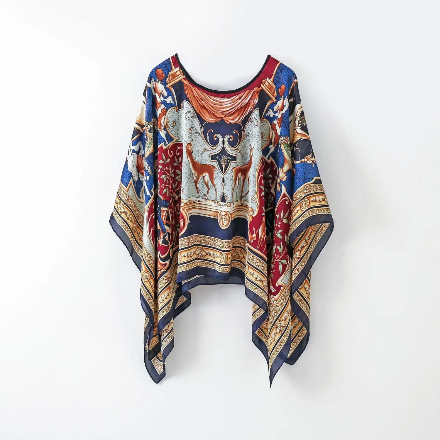 A flowing wide-sleeved printed silk patterned pullover shawl cape outerwear in rich navy blue with intricate red and gold baroque-inspired deer and scrollwork designs.