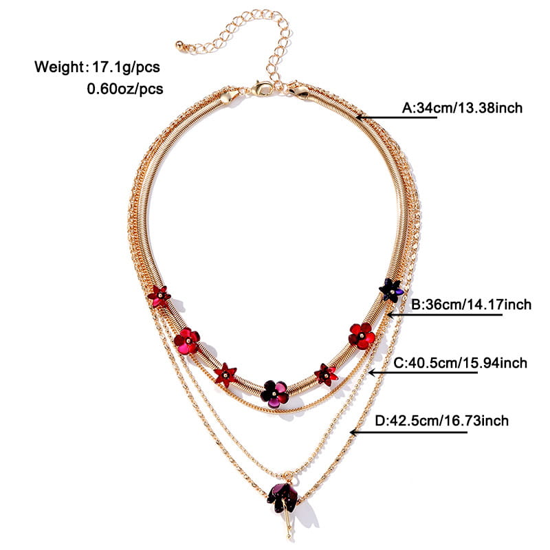 Gold-toned layered choker necklace featuring red and black floral acrylic charms.