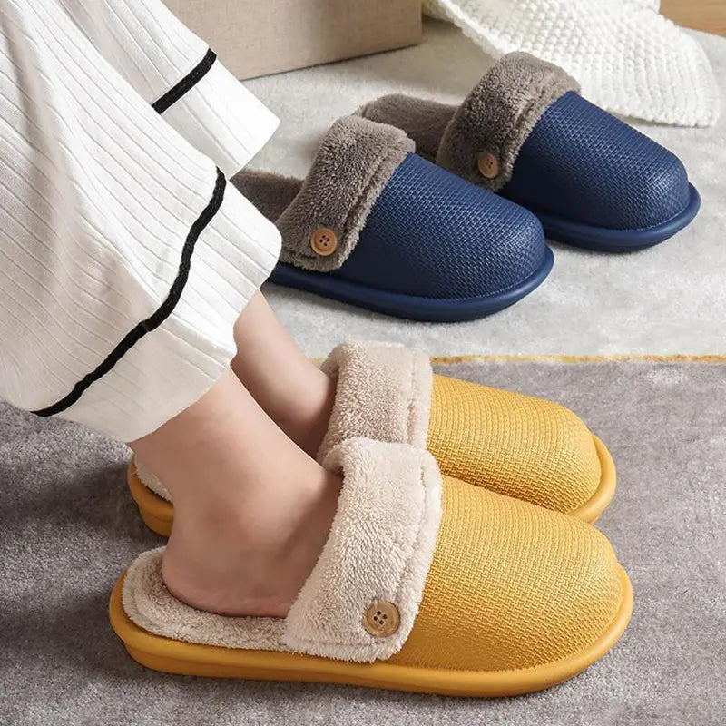 Winter slippers washable plush house shoes for women featuring yellow and beige slip-on design with a fuzzy cuff secured by a wooden button.