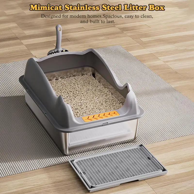 Caja para arena de gato grande de acero inoxidable con acabado en gris y acero inoxidable y un diseño moderno elegante, con un acento naranja en la parte frontal.