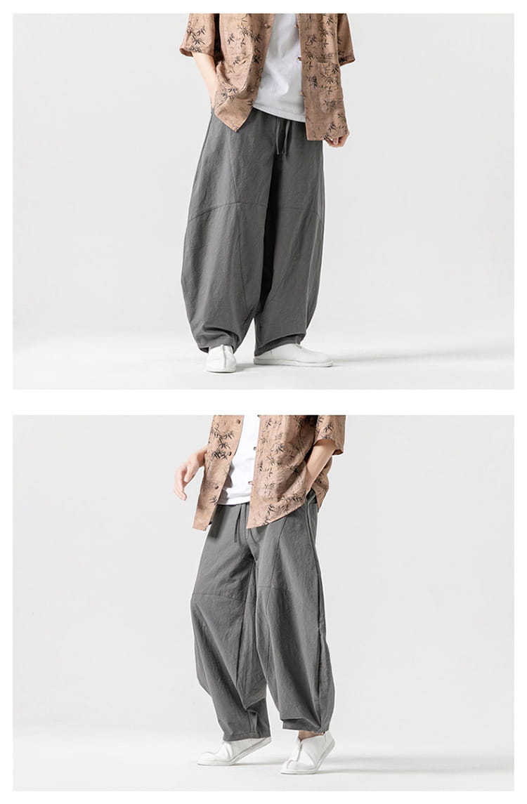 Pantalon ample en toile de tai-chi dans un style décontracté, avec tissu ample en coton de lin gris, taille à cordon et conception naturelle à plis.