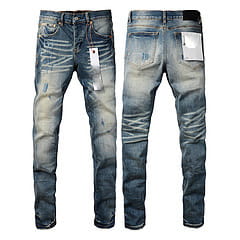 men’s distressed slim fit patchwork denim jeans in blue featuring distressed details and visible stitching on slim fit denim material