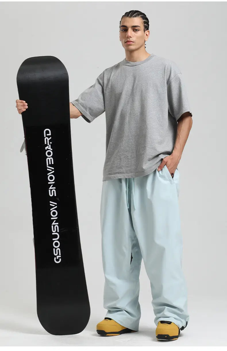 black snowboard featuring white gsousnow snowboard lettering paired with waterproof windproof loose work snow pants for outdoor use