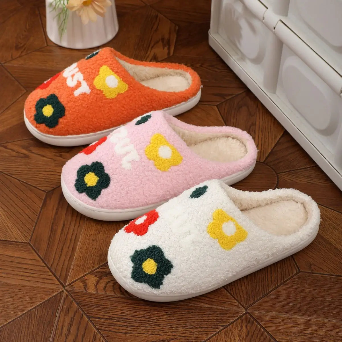 plush floral cotton slippers in orange pink and white with fuzzy slip-on design embroidered floral patterns soft fleece lining and soft tpr sole