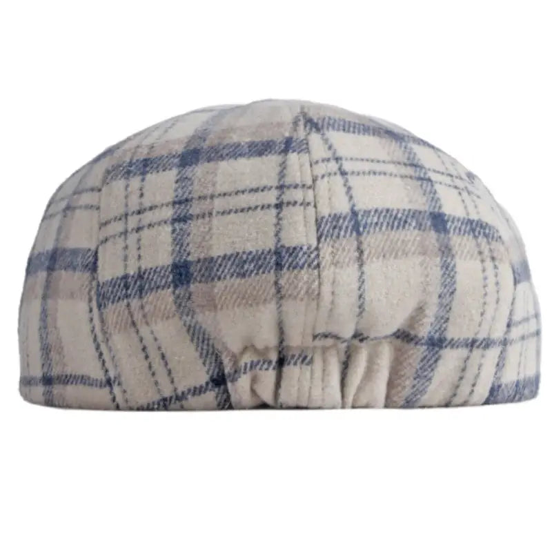 A cozy cream and blue plaid woolen octagonal hat for women with a soft quilted texture.
