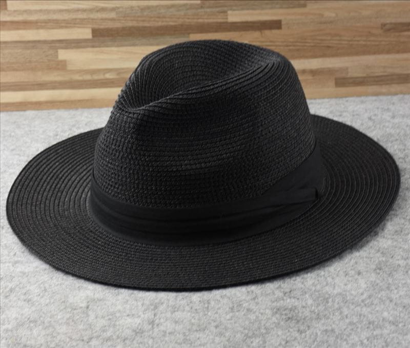 black woven straw fedora hat with a wide brim and matching satin ribbon band designed for foldable sun protection for men