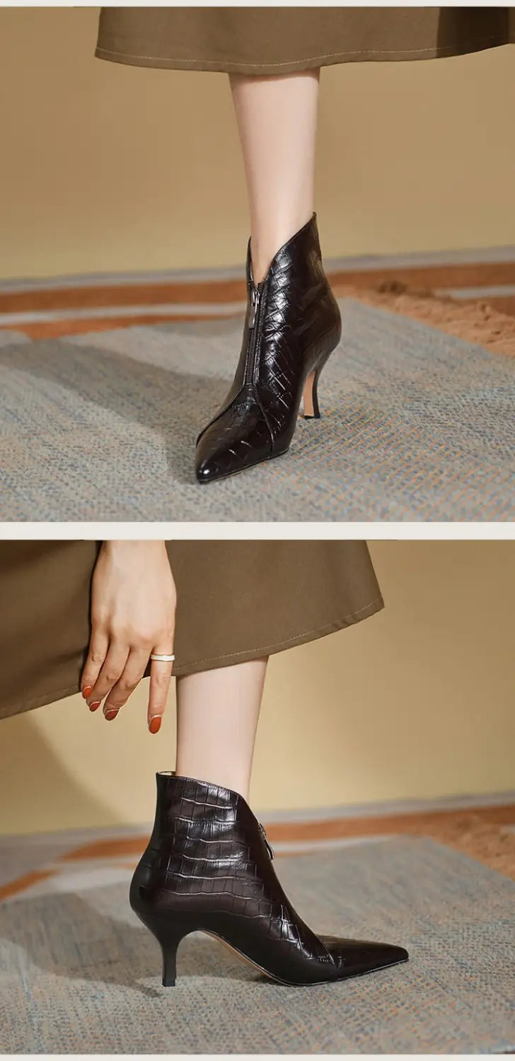 Black crocodile-embossed leather stiletto ankle boots with a pointed toe and slender heel.