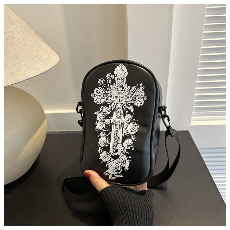 black crossbody bag with white ornate embroidered floral and cross design from the embroidered halloween floral and pumpkin crossbody bags collection