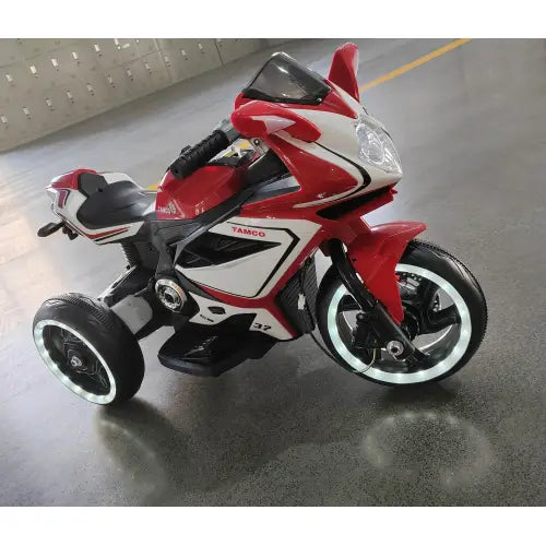 6v kids electric ride on motorcycle in red and white with black accents featuring a sleek sporty design and illuminated wheels.