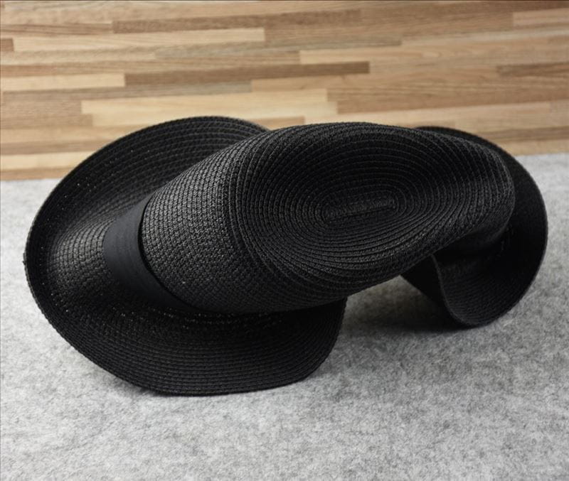 Black woven straw fedora hat with a sleek satin band designed for foldable sun protection men.