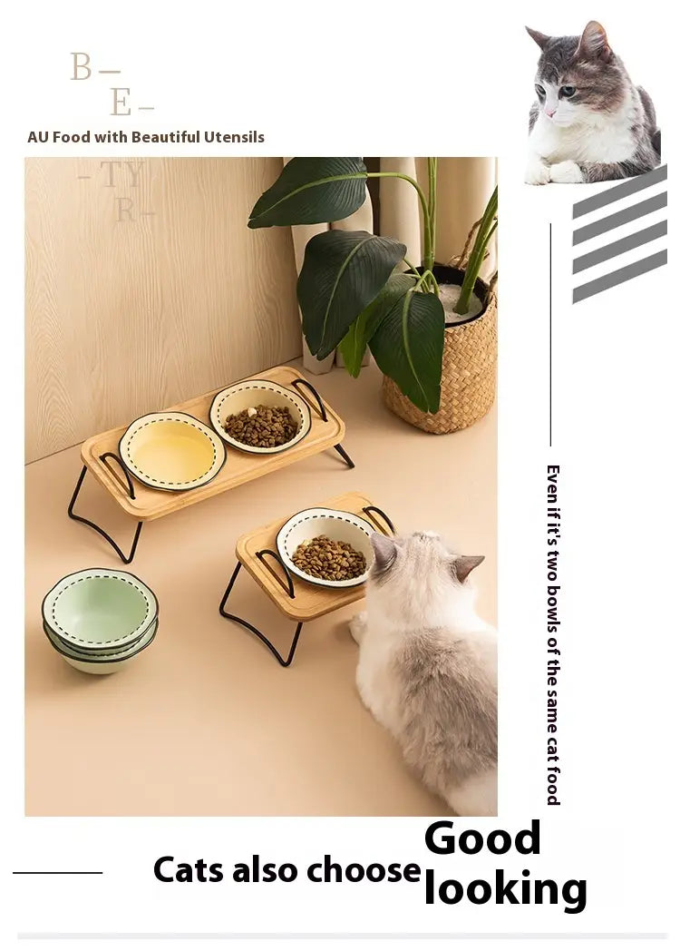 Set of three ceramic cat food bowls with green and white decorative rims displayed on wooden trays with black metal legs in an elevated ceramic cat bowl wooden stand.