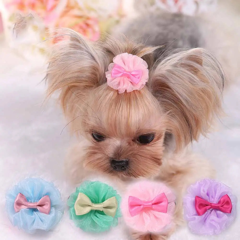 pink floral organza bubble dog hairpin with matching satin bow on top of the dog’s head pastel pet accessory
