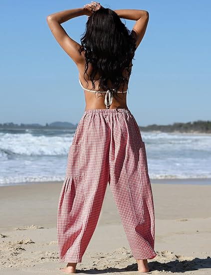 Checkered harem pants wide leg drawstring trousers in red and white gingham with a drawstring waistband.