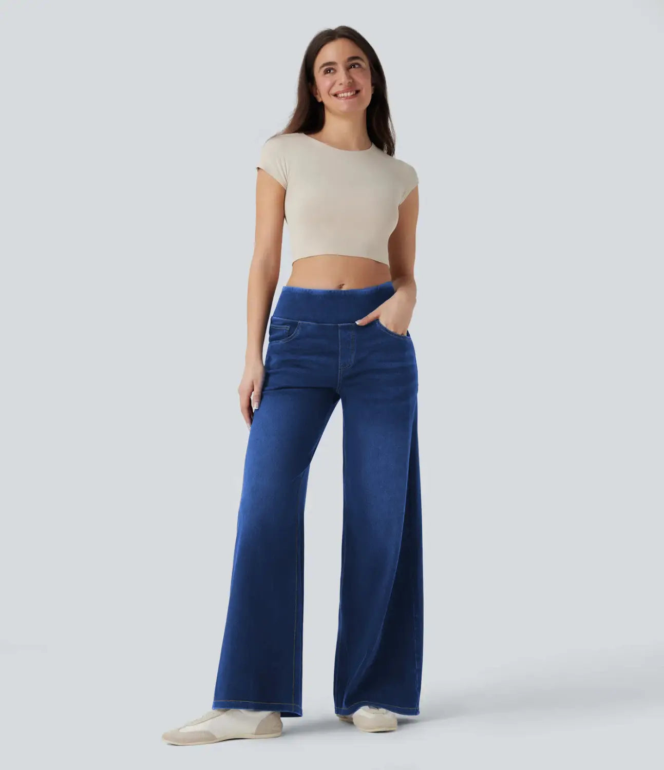 Blue wide-leg stretchy high waisted denim jeans with front pockets and a comfortable fit.