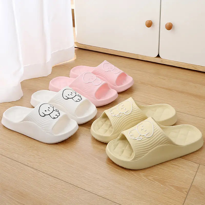 pink white and beige rubber slide sandals with cute cartoon dog faces on the non slip eva insole designed as house shoes