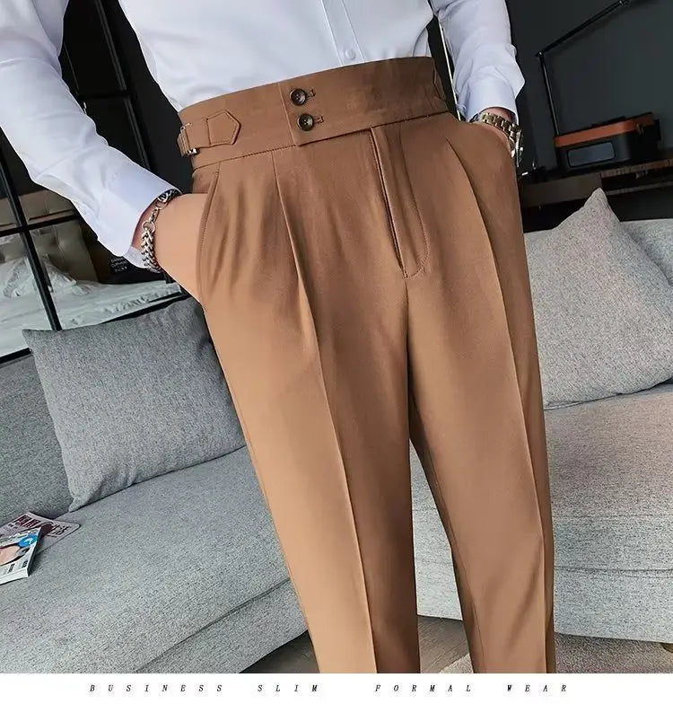 Tan Korean style slim fit men trousers feature a high-waisted slim fit design with a structured belt and double-button closure.