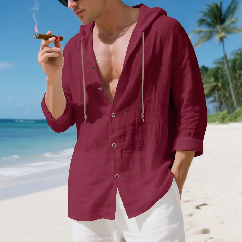 A maroon men linen hooded cardigan shirt with a relaxed fit, lightweight fabric, button-up front, and drawstrings for the hood.